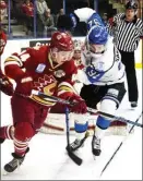  ?? DAVID CROMPTON/Penticton Herald ?? Forwards Jake Smith of the Chilliwack Chiefs, left, and Taylor Sanheim of the Penticton Vees battle in close quarters on Sunday at the SOEC.