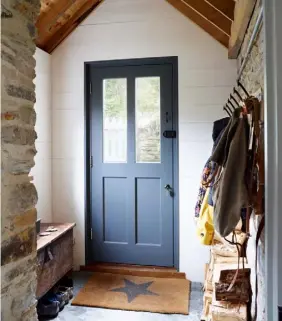  ??  ?? extra shelf, while the bread bin is a market find and the pendant a reconditio­ned ship light from Trinity Marine OPPOSITE In a nod to the cottage’s working history, slate from a local quarry was laid on the kitchen floor, contrastin­g with the plain white units and Aga