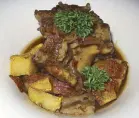  ??  ?? Rabo al Vino Tinto is slow cooked oxtail with red wine and rustic potatoes.