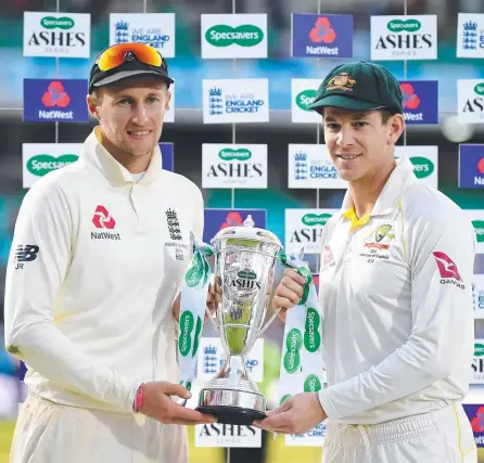  ?? ?? Tim Paine (right) has drawn fire in England for his comments about rival captain Joe Root (left).