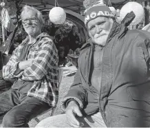  ?? ANDREW RANKIN • THE CHRONICLE HERALD ?? Ross Robicheau, left, and Wayne Moulton have been living in tents at the Meagher Park homeless encampment in Halifax for the past two months.