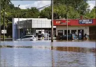  ?? Carol Kaliff / For Hearst Connecticu­t ?? Federal Road in Danbury is flooded Thursday, Sept. 2, 2021, as a result of heavy rains from Hurricane Ida.