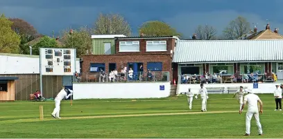  ?? ?? ●●Andrew Hall is solid in defence. He eventually made 31 not out. The ominous dark clouds in the distance brought torrential rain