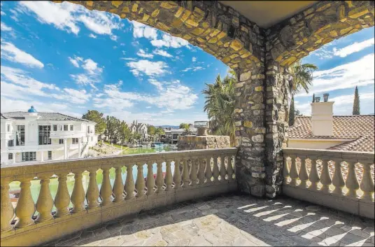  ??  ?? The master bedroom has its own private balcony overlookin­g the lake.