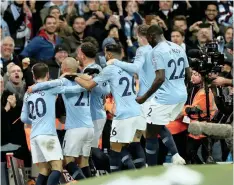  ??  ?? MANCHESTER CITY’S David Silva celebrates with his teammates. EPA