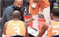  ??  ?? Suns coach Monty Williams huddles with players during the second quarter against the Pistons on Friday night.