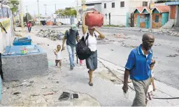  ?? Photo / AP ?? Residents flee gang violence in Port-au-Prince, Haiti.
