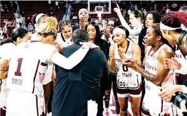  ?? ?? Mississipp­i State head coach Sam Purcell gathers his women’s basketball players around for a huddle after a game earlier this season. (Photo by Will Porada, MSU Athletics, for Daily Times Leader)
