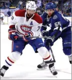  ?? The Canadian Press ?? Montreal Canadiens’ Andrei Markov, of Russia, here avoiding Tampa Bay Lightning’s Braydon Coburn, is heading home to the KHL.