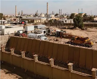  ?? Associated Press file photo ?? Iraq’s oil refinery in Beiji has not operated since the Islamic State group seized the town in 2014.