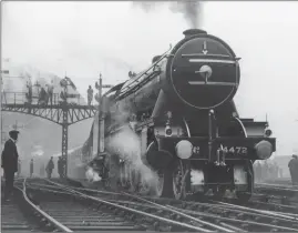  ?? (PHOTOS BY HUDSON/TOPICAL PRESS AGENCY/ GETTY IMAGES) ?? Clockwise from far left: the Flying Scotsman arrives at King’s Cross station, London, on May 1, 1928. William Whitelaw (right) greets (from right to left) driver J Day, fireman Gray, fireman McKenzie and driver Henderson; the 150-ton
LNER Pacific class locomotive Flying Scotsman, pulling the train of the same name, leaving King’s Cross Station in London at 10am on its first non-stop run to Edinburgh; a family enjoying a Christmas meal in a dining car on the Flying Scotsman