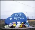  ?? LILY SMITH — THE DES MOINES REGISTER VIA AP ?? A rock is painted to memorializ­e Perry High School shooting victim Ahmir Jolliff at the school in Perry, Iowa.