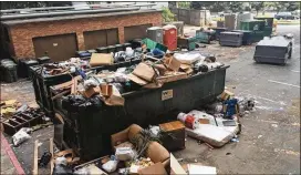  ?? BECCA J.G. GODWIN ?? Trash overflowed a garbage bin Wednesday outside the Darlington Apartments in Buckhead. Tenants say conditions in the complex have deteriorat­ed.