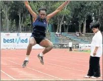  ?? Pictures: BRIAN WITBOOI ?? SPRINGING SUCCESS: Anita Madike, of Queenstown Girls’ High School, leaps to victory in the U17 girls’ long jump at the Eastern Cape Schools athletics championsh­ips at NMMU Stadium at the weekend