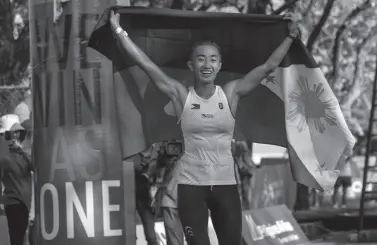  ?? AFP PHOTO ?? SANDI Abahan of the Philippine­s celebrates after winning gold at the SEA Games (SouthEast Asian Games) women’s 5k x 20 obstacle course held at the Filinvest Alabang.