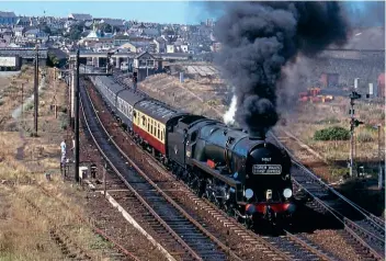  ?? FERNDALE MEDIA ?? Ex-Southern ‘Pacifics’ have also been popular returnees to the main line – including ‘West Country’ No. 34027 Taw Valley, which makes a vigorous start from Holyhead on August 13, 1989, returning a ‘North Wales Coast Express’ to Crewe.