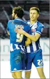  ??  ?? Will Grigg celebrates his side third a;sldkas