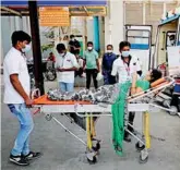  ?? Reuters ?? A patient who is having breathing difficulty is wheeled inside a Covid-19 hospital for treatment, amid the surge of coronaviru­s cases in Ahmedabad, yesterday.