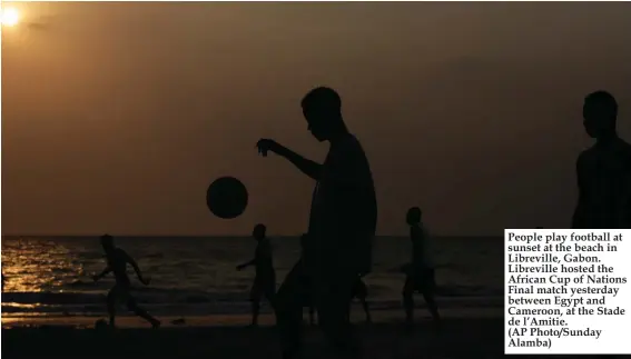  ??  ?? People play football at sunset at the beach in Libreville, Gabon. Libreville hosted the African Cup of Nations Final match yesterday between Egypt and Cameroon, at the Stade de l’Amitie. (AP Photo/Sunday Alamba)