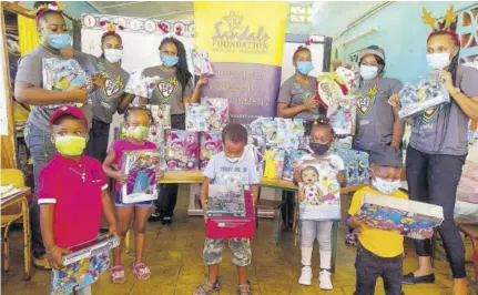  ??  ?? Students of Whitehouse Early Childhood Institute pose with toys donated by Sandals Foundation ambassador­s at Sandals and Beaches Negril Resorts in Westmorela­nd.