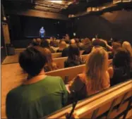  ?? ROBERT KUSEL—ASSOCIATED PRESS ?? In this October 2017photo, visitors watch Holocaust survivor Fritzie Fritzshall at The Abe &amp; Ida Cooper Survivor Stories Experience in the Illinois Holocaust Museum&amp; Education Center in Skokie, Ill. The experience combines high-definition holographi­c interview recordings and voice recognitio­n technology to enable Holocaust Survivors to tell their deeply moving personal stories and respond to questions from the audience.