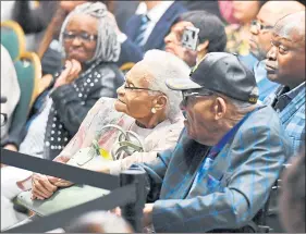  ?? MANDEL NGAN — AFP VIA GETTY IMAGES ?? Tulsa race massacre survivors Viola Fletcher, center, and Hughes Van Ellis listen as President Joe Biden speaks on the 100th anniversar­y of the massacre in Tulsa, Okla., on Tuesday.