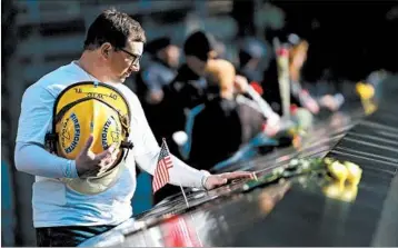  ?? DREW ANGERER/GETTY ?? James Taormina, whose brother Dennis died in the 9/11 attacks, pauses Monday before a ceremony in New York City.