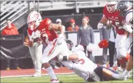  ?? Krista Benson / For Hearst Connecticu­t Media ?? Sacred Heart’s Jordan Meachum, left, barrels into the end zone for a touchdown while Robert Morris Adam Wollet tries to stop him at Sacred Heart in Fairfield on Saturday.