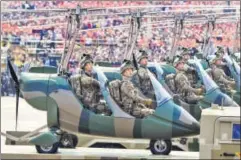  ??  ?? Military aircraft on display at the event in Beijing on Tuesday.
AFP