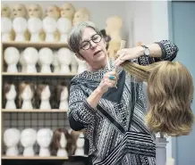  ?? DARRYL DYCK/THE CANADIAN PRESS ?? Frances Rae is manager of Eva and Company Wigs, where a collection of wigs, some earmarked to go to children at B.C. Children’s Hospital, was stolen early Friday morning.