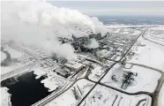  ?? TYLER BROWNBRIDG­E/Postmedia News ?? The Syncrude Oil Sands project north of Fort McMurray, Alta. Prime Minister Stephen Harper said Tuesday that Canada will
not move unilateral­ly to halt rising emissions.