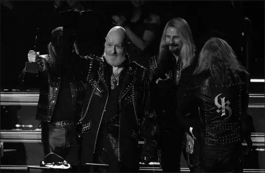  ?? CHRIS PIZZELLO / ASSOCIATED PRESS FILE (2022) ?? Inductees, from left, Glenn Tipton, Rob Halford, Richie Faulkner and Ian Hill of Judas Priest speak during the Rock & Roll Hall of Fame Induction Ceremony in 2022 at the Microsoft Theater in Los Angeles. Hill, now 72, says he still loves the band he helped found.