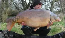  ??  ?? „ Steve Kitcher with a mirror carp – but the species can be farmed.