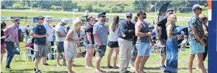  ??  ?? Busy day . . . Punters were keen to get some liquid refreshmen­ts at Wingatui.