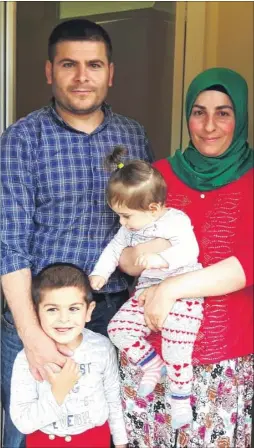  ?? Picture: Alex Claridge FM4401636 ?? Ismail Darioglu with wife Leyla and their children Yunus and Kubra are among the first Redbridge families to move to Howe Barracks