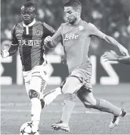  ?? AP ?? Nice’s Jean Michael Seri (left) and Napoli’s Dries Mertens vie for the ball during a Champions League play-off round, second-leg match in Nice, France yesterday.