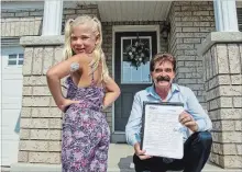  ?? BETH AUDET TORSTAR ?? Seven-year-old Maya Webster, seen with supporter MPP Wayne Gates, shows her continuous glucose monitor on her upper arm.