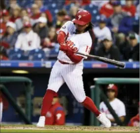  ?? MATT SLOCUM — THE ASSOCIATED PRESS ?? The Phillies’ Freddy Galvis hits a run-scoring single off Atlanta starting pitcher Bartolo Colon during the second inning Friday at Citizens Bank Park.The Phillies won, 4-3.