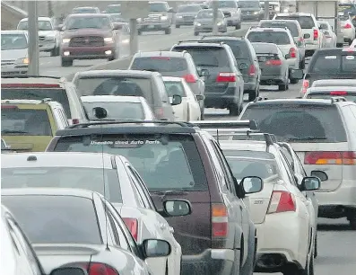  ?? CALGARY HERALD/ FILES ?? The Deerfoot backs up after a collision ahead. Gridlock in Calgary has some frustrated drivers coming up with new and unique solutions to the challenge of merging into heavy traffic.