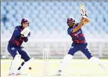  ??  ?? Roston Chase of West Indies bats as Joshua Da Silva of West Indies watches during day one of a West Indies warm up match at Old Trafford in
Manchester, England on June 23. (AP)