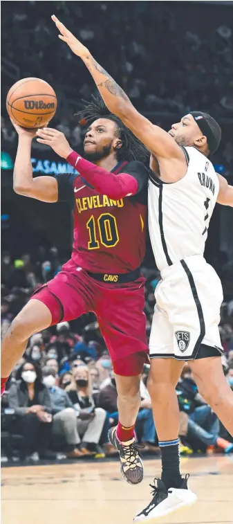  ?? Picture: Getty Images ?? Cavalier Darius Garland shoots over Bruce Brown of the Nets during the fourth quarter in Cleveland on Tuesday.