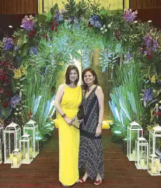  ??  ?? Lizette Cojuangco and Rose Anne Belmonte by the entrance to the Grand Ballroom.