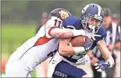  ?? Steven Eckhoff / Rome News-Tribune ?? Berry wide receiver Mason Kinsey is tackled by Hendrix’s Chad McGonigal during Saturday’s game.