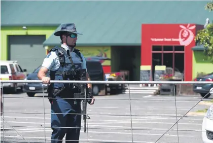  ?? Picture / George Novak ?? Armed police turned people away from the fruit farm after the incident.