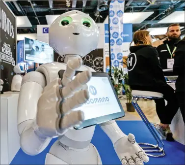  ?? REUTERS ?? SoftBank humanoid robot known as Pepper is seen at the SIdO, the Connected Business trade show, in Lyon, France, on Thursday. While brands have demanded greater control over the videos where their ads appear, the step taken by YouTube this week is...