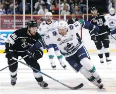  ??  ?? Power plays were rampant Thursday during the Canucks-Kings game in Shanghai as the NHL continues its crackdown of stick fouls.