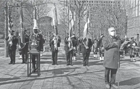  ?? MARY ALTAFFER/AP ?? Charles Maikish, right, the former director of the World Trade Center, reads the names of the victims of the 1993 bombing of the World Trade Center during a ceremony marking the 28th anniversar­y of the attack on Friday in New York.