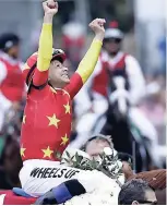  ??  ?? Jockey Mike Smith reacts after guiding Justify to win the 150th running of the Belmont Stakes horse race, last Saturday.