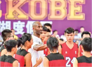  ??  ?? Former NBA basketball player Kobe Bryant attends a basketball teaching activity in Haikou in China's southern Hainan province on Wednesday. (AFP)