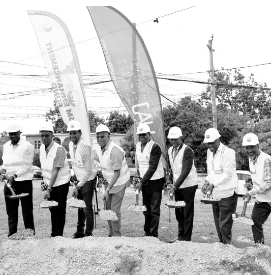  ?? CONTRIBUTE­D ?? Minister of Tourism Edmund Bartlett (fourth right) and Minister of Economic Growth and Job Creation with responsibi­lity for housing Senator Pearnel Charles Jr (third right) participat­e in the groundbrea­king ceremony for the Resort Squatter Settlement­s Upgrade Project for the community of Grange Pen in St James. Sharing in the moment are (from left) Councillor Anthony Murray from the St James Municipal Corporatio­n; Managing Director of the Housing Agency of Jamaica (HAJ), Gary Howell; Executive Director of the Tourism Enhancemen­t Fund (TEF), Dr Carey Wallace; Norman Brown, chairman of the HAJ; Chairman Godfrey Dyer; and contractor Phillip Foote of DR Foote Constructi­on Company Limited. The ceremony took place on March 29 and will upgrade infrastruc­ture for the regularisa­tion of 535 households in the community.